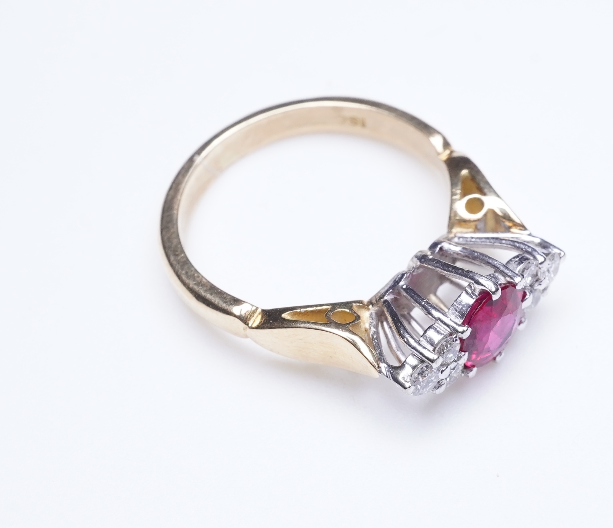 A synthetic ruby and diamond ring